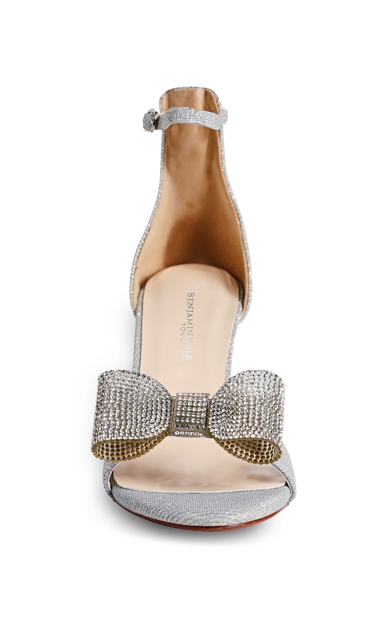 The Esme Silver Prom Shoes (Touch Ups 4744) showcase an ankle strap stiletto design with a large rhinestone bow on the front, elegantly set against a white background.